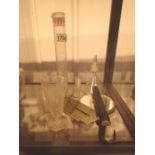 Collection of scientific beakers measures thermometers etc.
