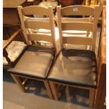 Two modern upholstered oak dining chairs