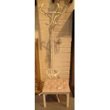 White six arm coat stand and white stool with pink fabric top