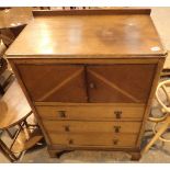 Oak tallboy with cupboard over three drawers