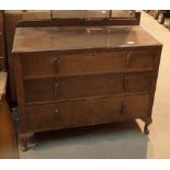 Oak three drawer dressing table and a spindle back chair