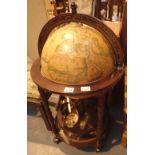 World globe drinks cabinet on mahogany stand