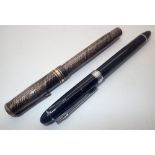 Two modern fountain pens one lever fill