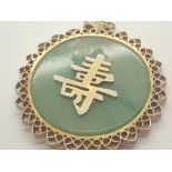 Jade and yellow metal pendant D: 48 mm