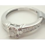 9ct white gold diamond solitaire ring with diamond set shoulders size J / K RRP £700.