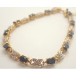 Yellow metal sapphire and diamond set bracelet 10.