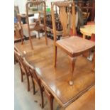 Walnut extending dining table with two leaves and six chairs including one carver A/F on cabriole