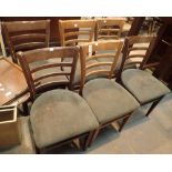 Set of six ladder back chairs with green upholstered seats