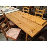 Pine table and four chairs with seat pads