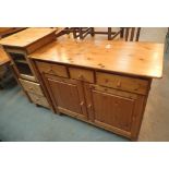 Pine three drawer sideboard and a pine glass fronted cupboard