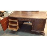 Good French carved desk with twin cupboards revealing drawers one central drawer and large claw