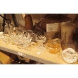 Shelf of glass candle holders and candles Air Wick etc