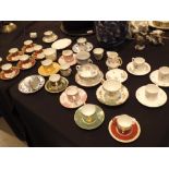 Mixed coffee cans and saucers including Wedgwood and Minton