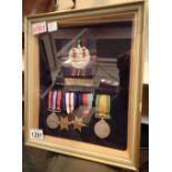 Framed Scottish Cameron Highlander medal group and badge to Cpl Leonard Massey 4393449