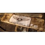 Bentley Motors sign on wooden base