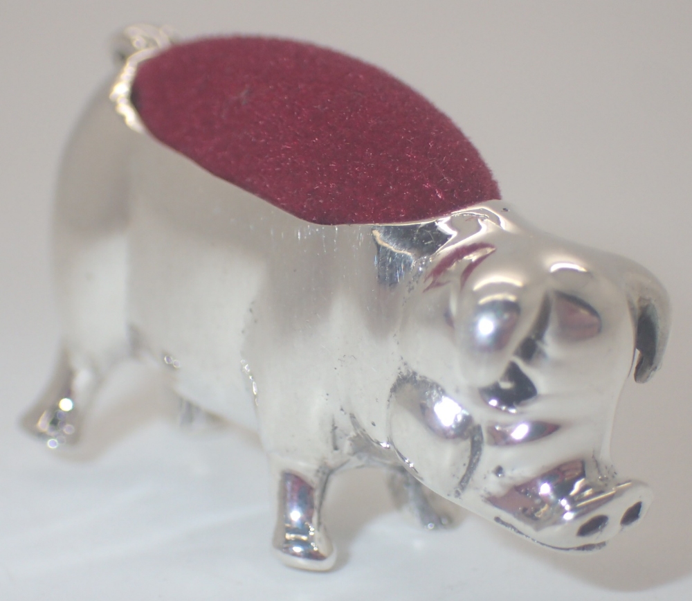 Silver pig pin cushion