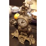 Antique style cast metal figural mantel clock with Italian drum head movement