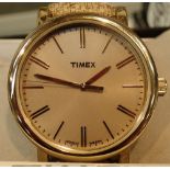 Boxed new old stock gents gold tone Timex wristwatch with gold buttons on rubber strap