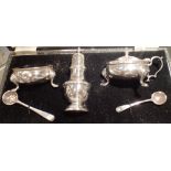 Cased and hallmarked silver condiment set mustard pepperette open salt with blue glass liner and