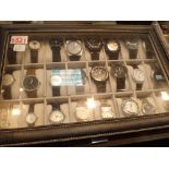 Display case of twenty four assorted wristwatches including mechanical examples