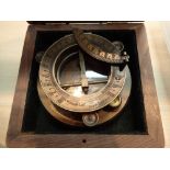 Boxed brass sundial and compass marked J.