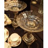 Pair of white metal and glass table centers