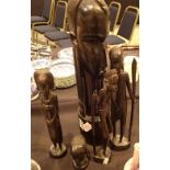 Five ebonised carved African figurines tallest H: 45 cm