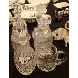 Five mixed crystal decanters and a jug