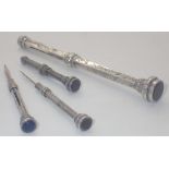 Victorian silver propelling pencil a further smaller example and two white metal propelling