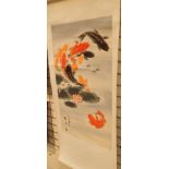 Chinese hand painted silk mounted scroll of Koi carp among lotus 84 x 44 cm