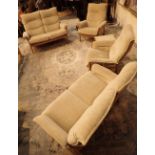 Ercol elm four piece suite comprising two two seater settees and two armchairs and a matching