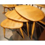 Ercol nest of three light elm tables CONDITION REPORT: Good condition with all