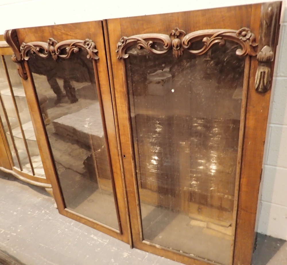 Double door glazed walnut bookcase top with carved detail 124 x 36 x 123 cm H