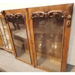 Double door glazed walnut bookcase top with carved detail 124 x 36 x 123 cm H