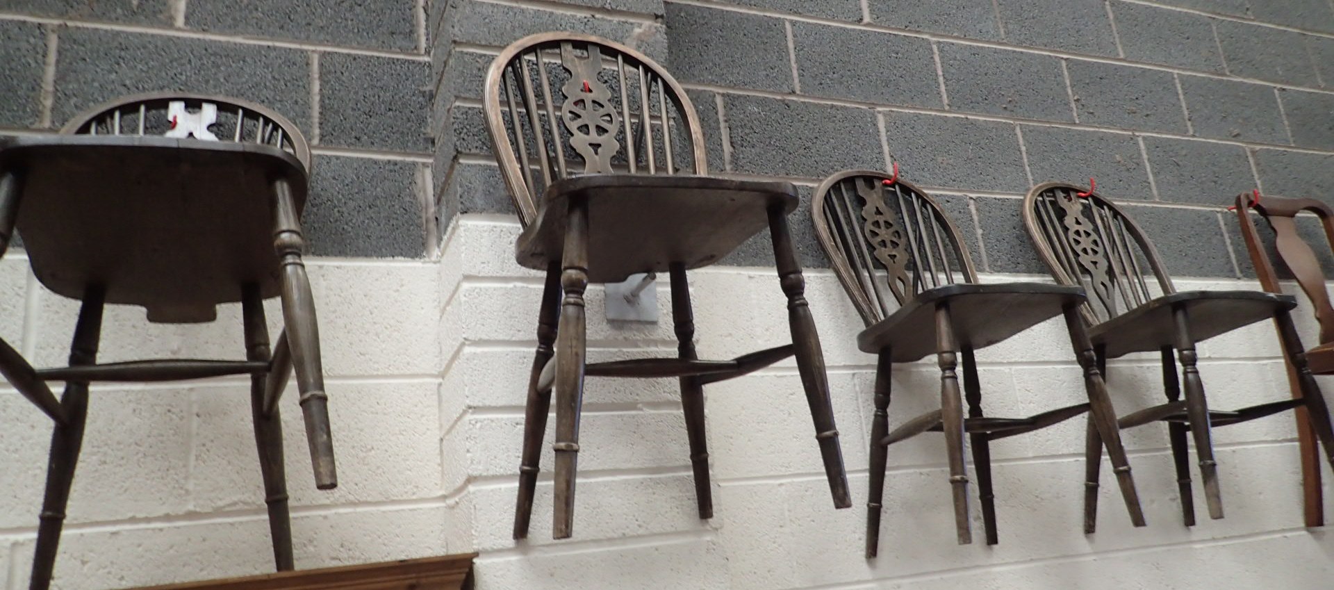 Four oak wheelback chairs
