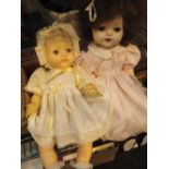 Two vintage dressed dolls