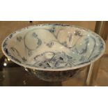 Chinese porcelain circular bowl painted in underglaze blue with floral motifs scrolls and whorls