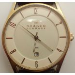 Gents yellow metal white face Skagen date wristwatch on leather strap