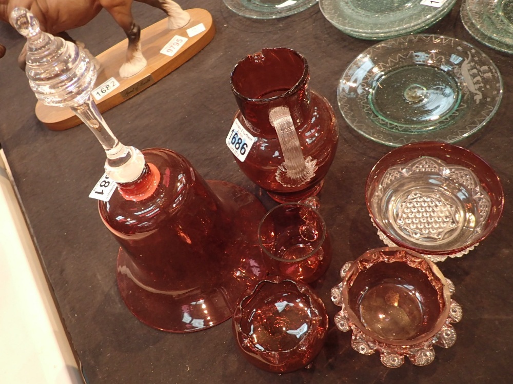 Six pieces of Cranberry glass large bell three small bowls and cup