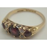 18ct gold garnet and and diamond ring size M 3.