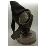 WWII German childs gas mask with eagle and swastika with rubber in good condition