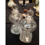 Pair of handmade nipped waist glass decanters with polished pontil