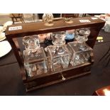Mahogany cased three bottle tantalus with key CONDITION REPORT: No visible markings
