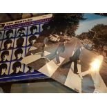 Collection of nine Beatles LP records including Abbey Road Hard Days Night Rubber Soul