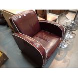 Retro red leather armchair with white piping