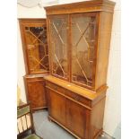 Two modern display cabinets with glazed doors and lower cupboard