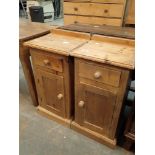 Pair of pine bedside tables with single drawer over cupboard