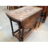 Antique oak dropleaf dining table with barleytwist supports