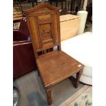 Arts and Crafts oak wainscott chair with carved horse design to back