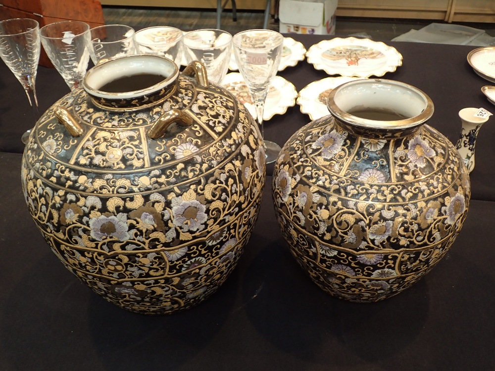 Two large Chinese black ground pots tall